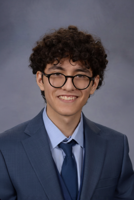 Portrait of Mario Belmonte in a blue suit and tie